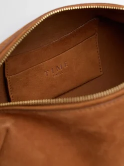 Elongated suede shoulder bag