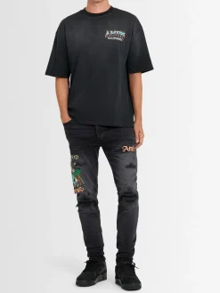 Jeans skinny ricamati Sinners