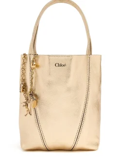 Spin metallic leather top handle bag