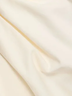Top asimmetrico in cotone drappeggiato